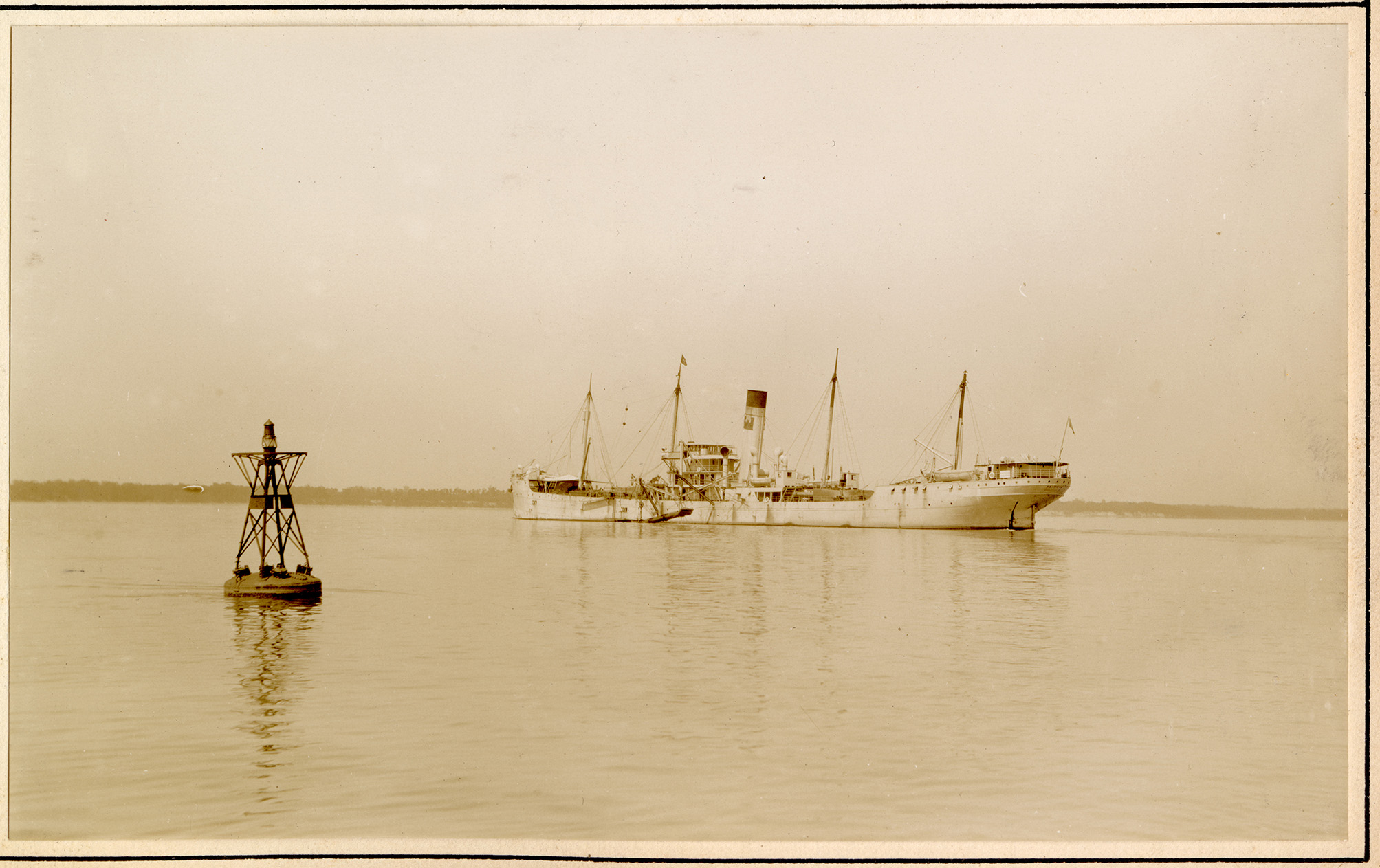 Large ship in open water near buoy